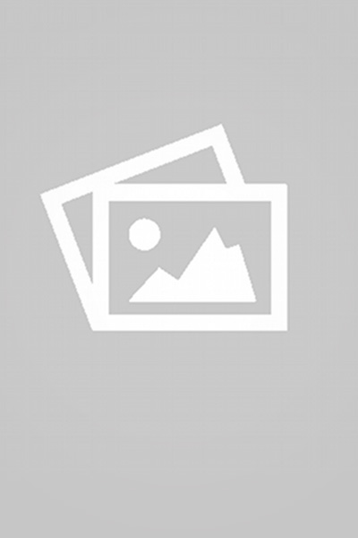 A yellow building and a yellow windows with a flower and plants.